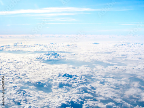 Above the cloud, sky view from airplane window. © tete_escape