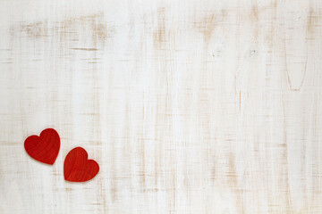 Red Valentine's Day hearts on wooden background