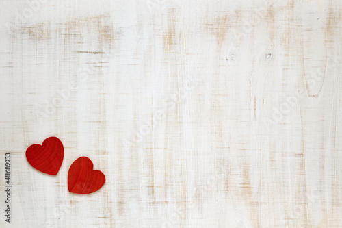 Red Valentine's Day hearts on wooden background