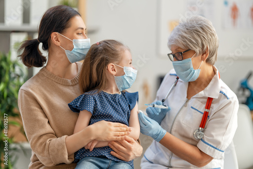 Doctor vaccinating child