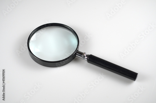 Magnifying glass on white background with gentle depth of field. Magnifier tool.