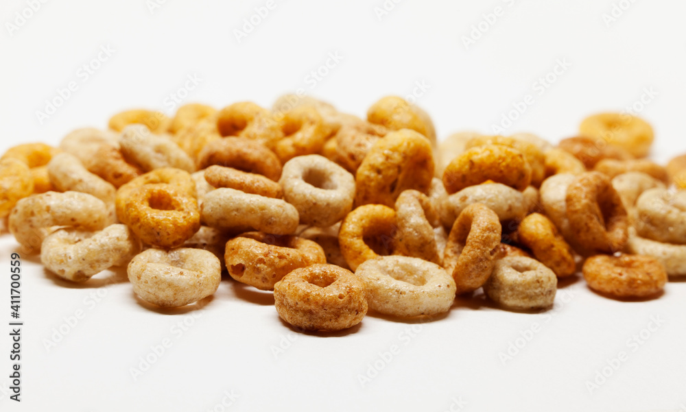 a pile of round breakfast cereals on a white background a pile of round breakfast cereals on a white background