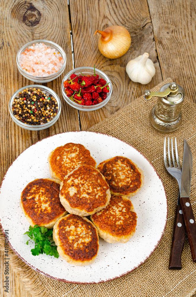 Homemade meat cutlets on wooden table. Studio Photo