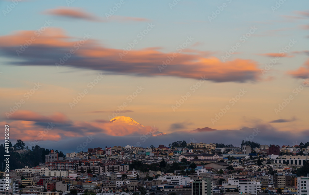 Cayambe volcano sunset and Quito city, Ecuador.