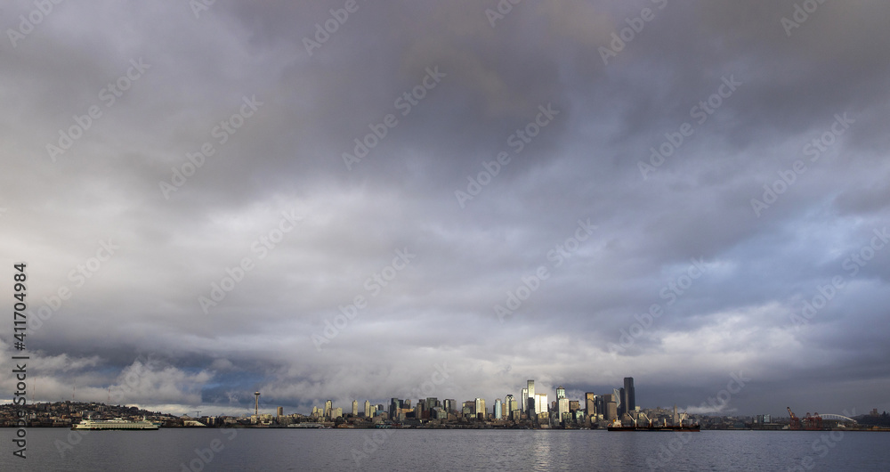 View of the city of Seattle over the Puget sound as seen from Alki Beach in West Seattle View of the city of Seattle over the Puget sound as seen from Alki Beach in West Seattle