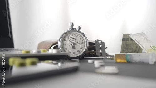 Running hours and tablets on a white background