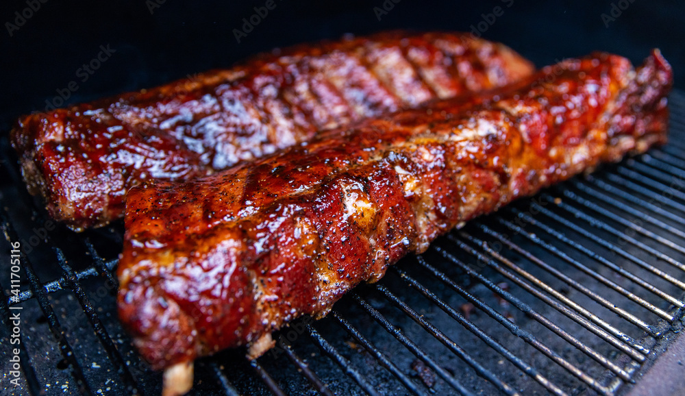 Babyback pork ribs cooking on a pellet grill smoker