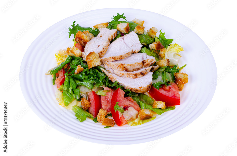 Home kitchen. Vegetable salad with chicken and croutons. Caesar. Studio Photo