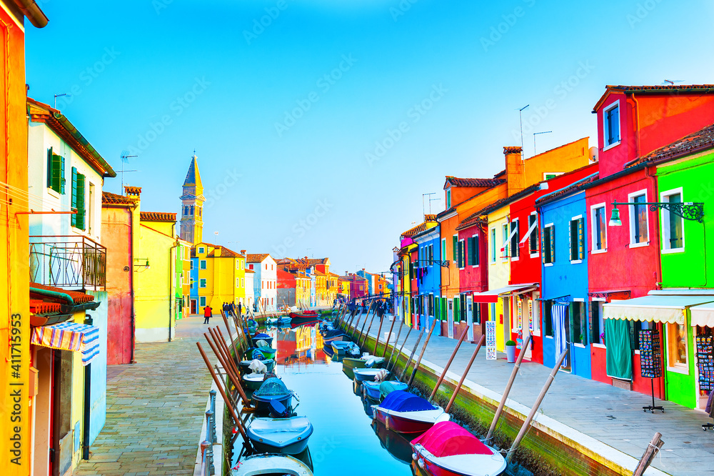 Colorful houses on the canal in Burano island, Venice, Italy. Famous travel destination. 