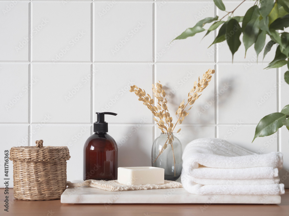 White bath background front view with cosmetic bottle and bath accessories - obrazy, fototapety, plakaty 