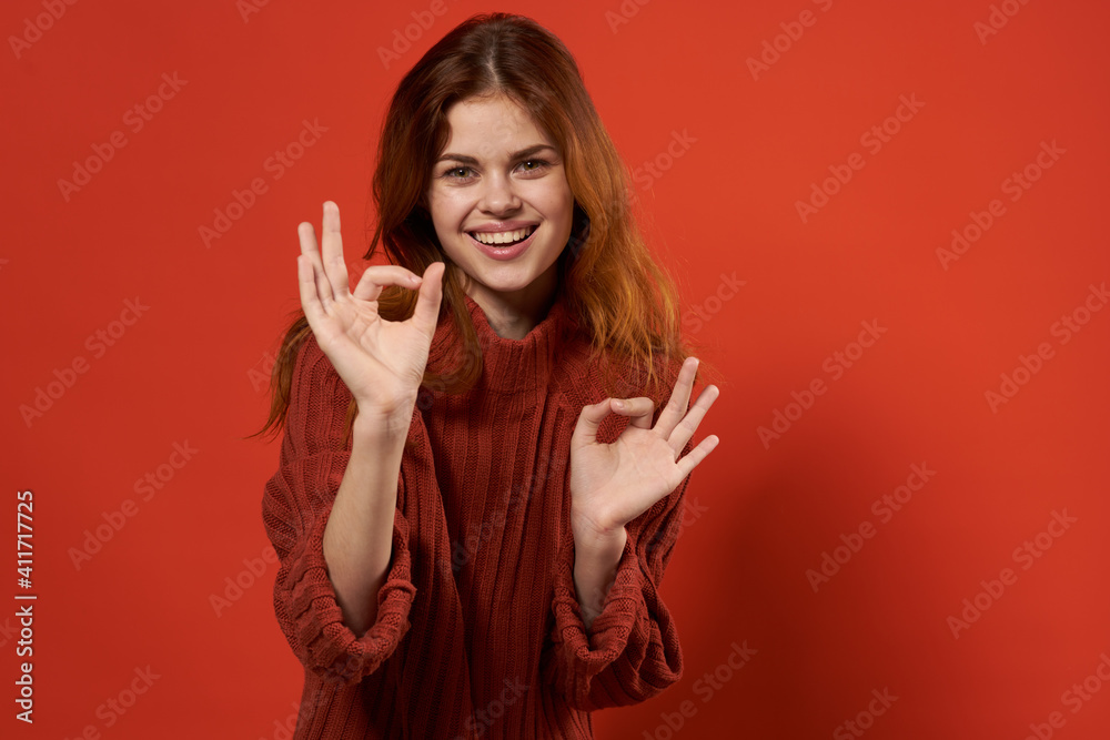 pretty woman red sweater gesture hands posing red background pretty woman red sweater gesture hands posing red background