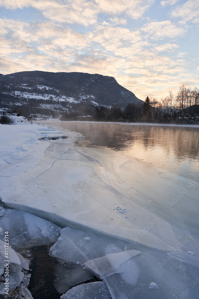 Winter theme at Hallingdalselva. A beautiful river in Hallingdal, Gol is freezing up in the cold February morning.  