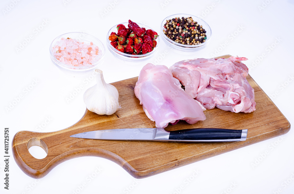 Raw meat. Two pieces of chicken thighs for cooking. Studio Photo