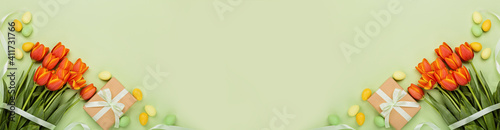 Photography Stylish background with colorful easter eggs pastel colors isolated on green background