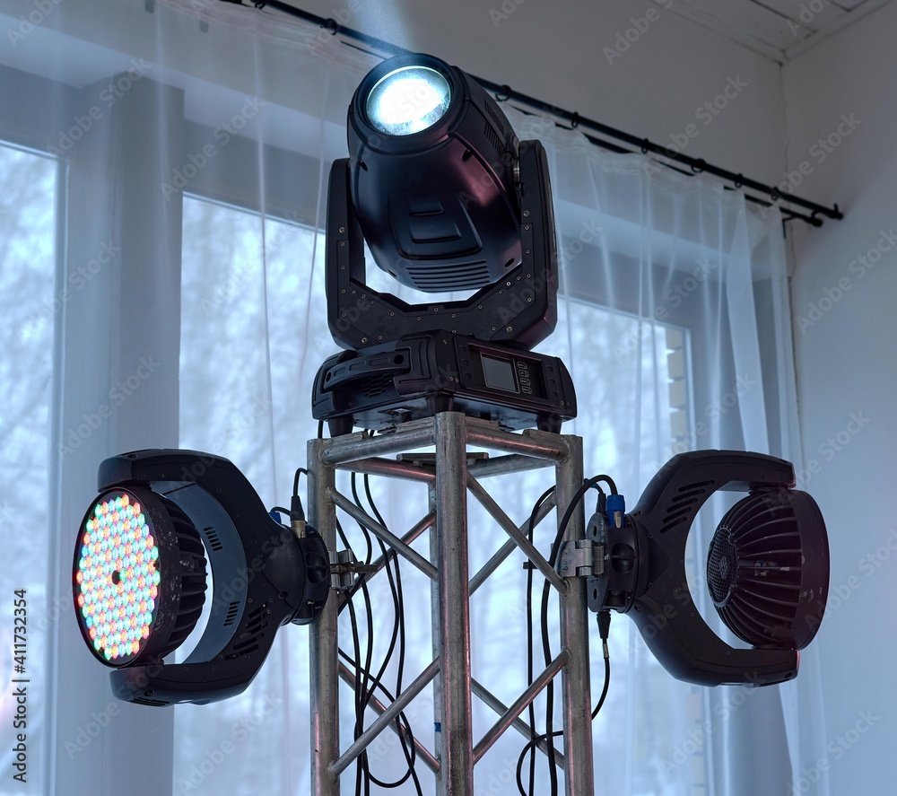 Multi-colored LED spotlight on the counter. .Lighting equipment for discos, events, banquets. Professional lighting equipment for events