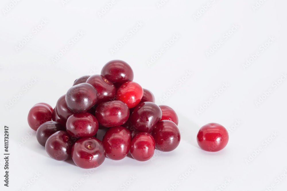 Cherry berries on a white background. Copy space. Cherry berries on a white background. Copy space.