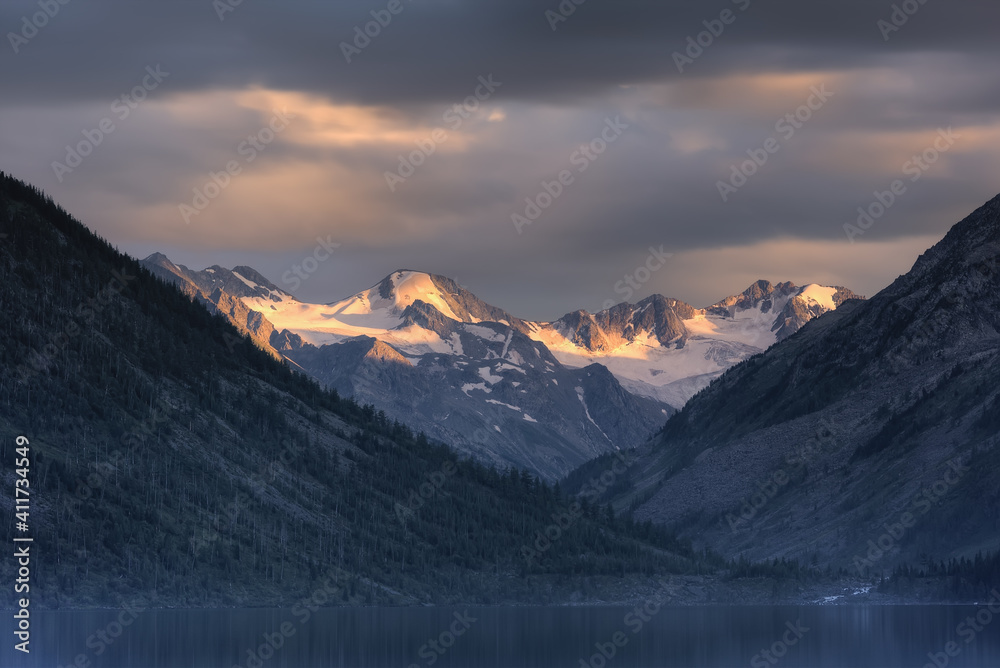 Mountain landscape. Mountain lake, mountains with glaciers.