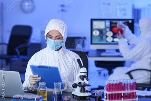Scientist studying sample i...