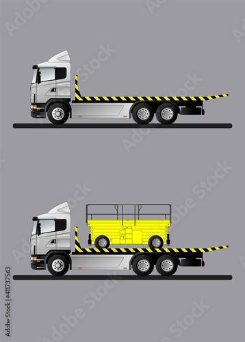 Image of a modern European truck for transporting special equipment. The tow truck is transporting a diesel hydraulic scissor lift.