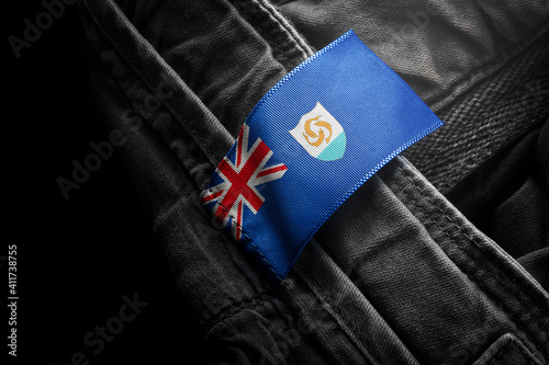 Tag on dark clothing in the form of the flag of the Anguilla