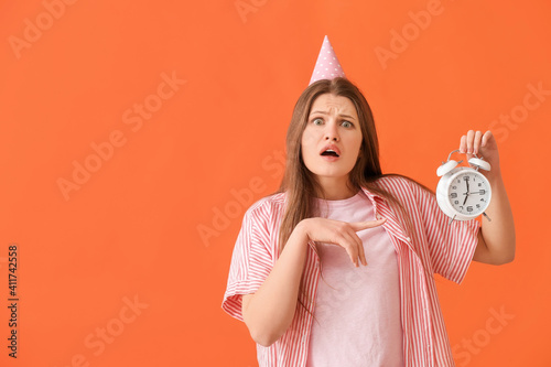 Stressed woman with alarm c...