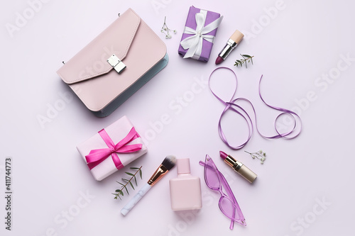 Beautiful composition with female accessories for International Women's Day on light background