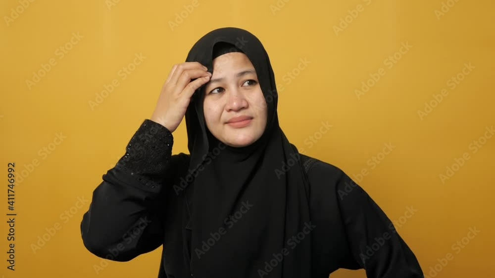 Portrait of Asian muslim woman wearing hijab looks confused and worried gesture, don't know what to do, facing big problem Portrait of Asian muslim woman wearing hijab looks confused and worried gesture, don't know what to do, facing big problem