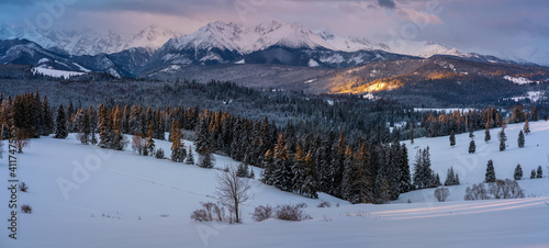 Panorama of mountain scenery during a beautiful winter sunrise