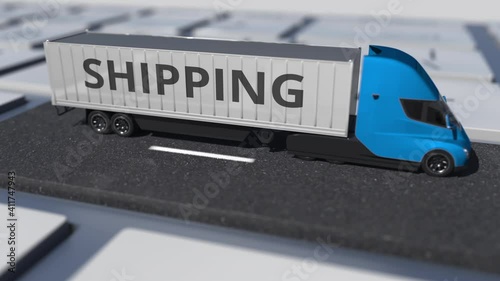 SHIPPING text on the truck driving on the keyboard key. Conceptual looping 3d animation photo