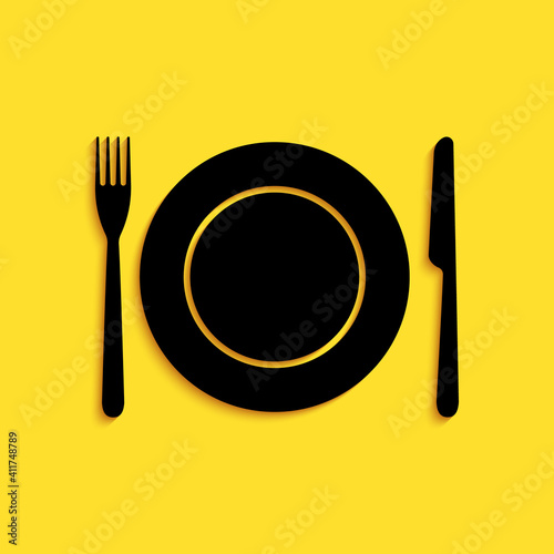 Black Plate, fork and knife icon isolated on yellow background. Cutlery symbol. Restaurant sign. Long shadow style. Vector.