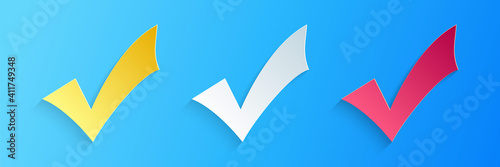 Paper cut Check mark icon isolated on blue background. Tick symbol. Paper art style. Vector.