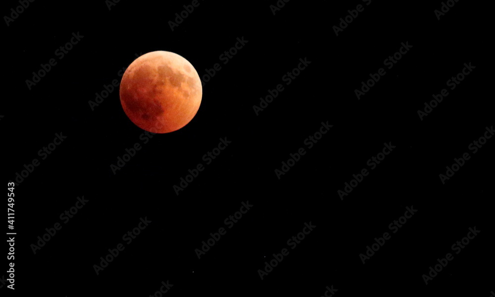 evocative image of moon eclipse at night up in the sky
evocative image of moon eclipse at night up in the sky