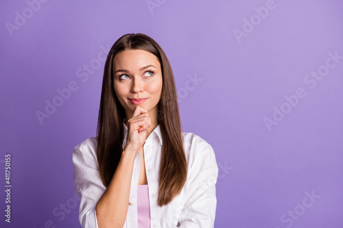 Photo of minded smart lady finger chin look up empty space wear white shirt isolated purple color background