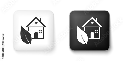 Black and white Eco friendly house icon isolated on white background. Eco house with leaf. Square button. Vector.