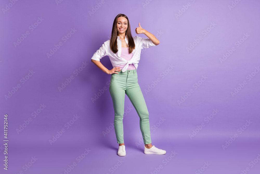 Photo of young adviser woman raise thumb up toothy beaming smile wear white shirt isolated violet color background