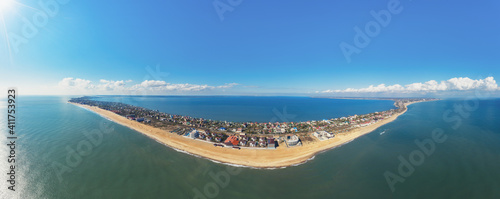 Aerial view of the spit (relief) with the city. Horizontal panorama. The Black Sea and Dniester estuary. Zatoka, Odesa region, Ukraine