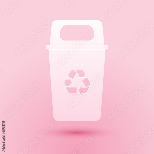 Paper cut Recycle bin with recycle symbol icon isolated on pink background. Trash can icon. Garbage bin sign. Recycle basket sign. Paper art style. Vector.