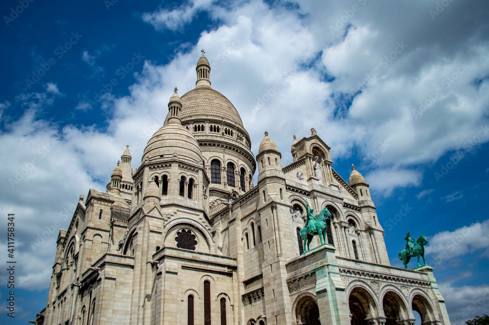 Paris, France - July 19, 2019: Basilica of the Sacred Heart (SacrÃ© Coeur), a masterpiece of religious architecture in Paris, France