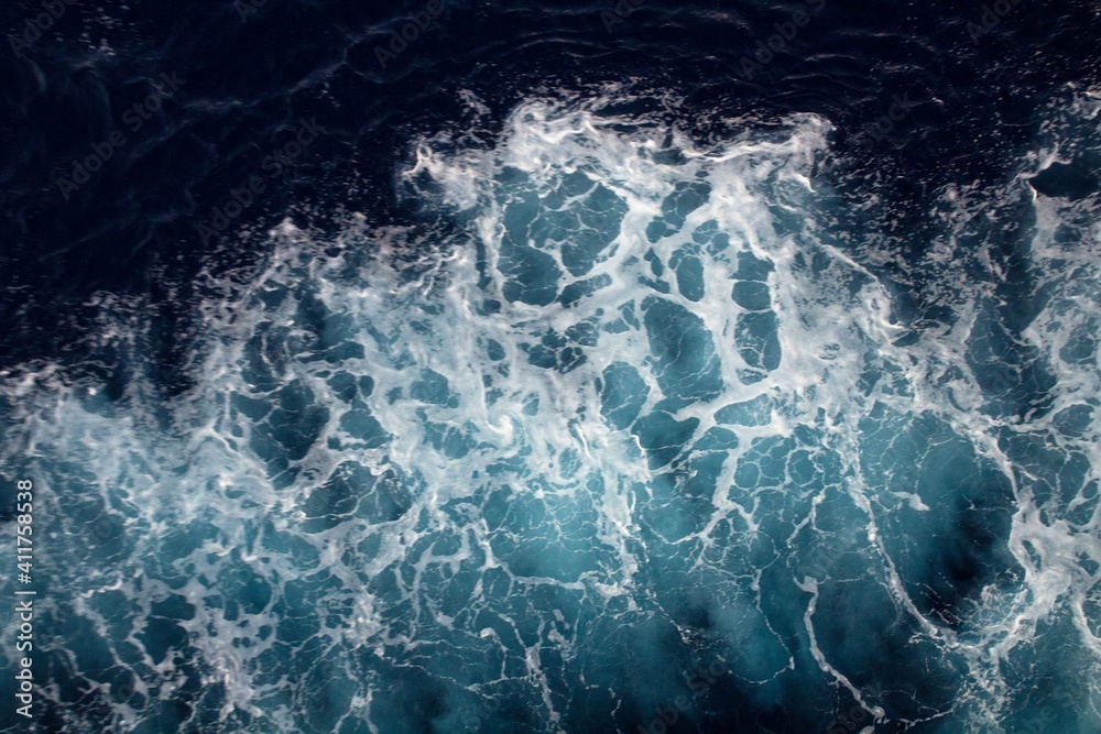 evocative image of sea waves with white foam caused by the movement of a ferry
evocative image of sea waves with white foam caused by the movement of a ferry
