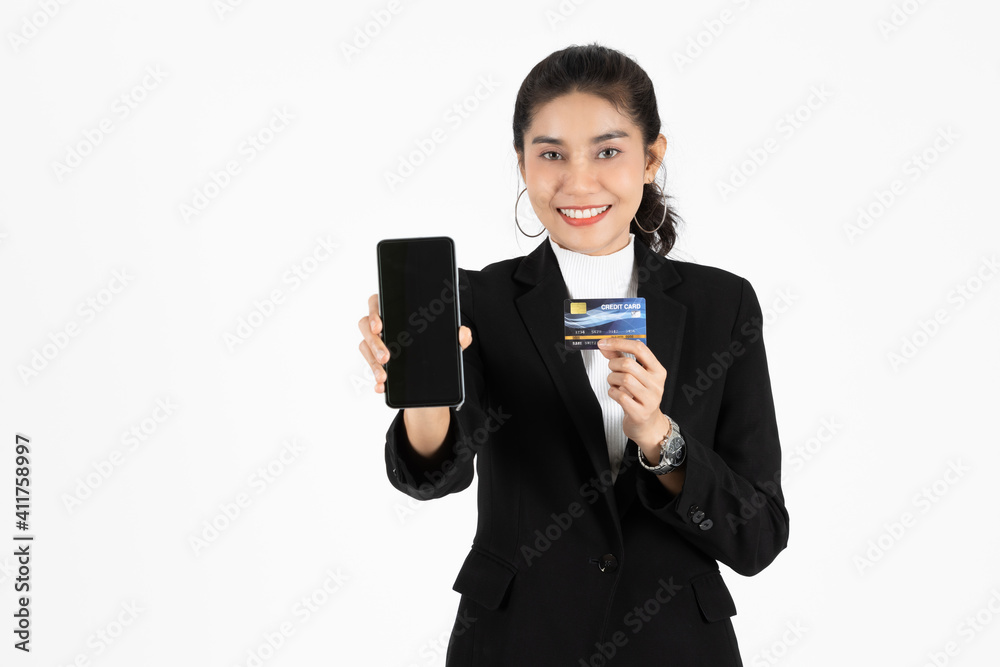 Attractive happy young Asian business woman showing screen of mobile smart phone over white isolated background. Social network, Shopping online concept. Attractive happy young Asian business woman showing screen of mobile smart phone over white isolated background. Social network, Shopping online concept.