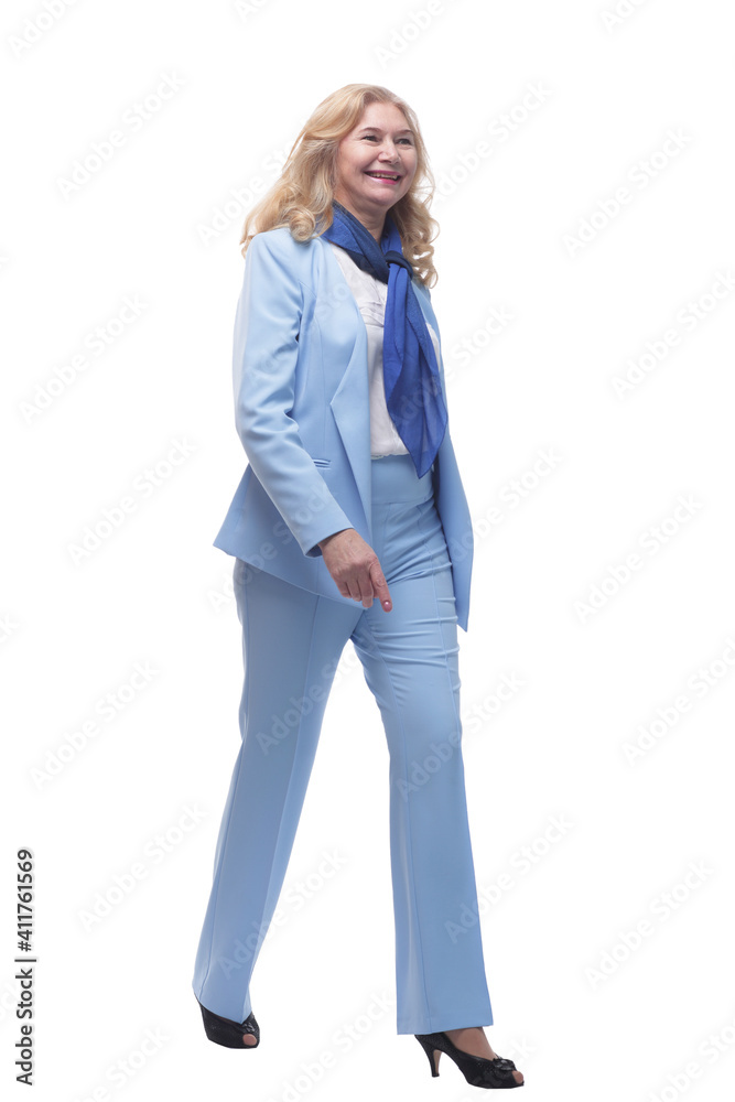 in full growth. happy woman in a pantsuit striding forward. in full growth. happy woman in a pantsuit striding forward.