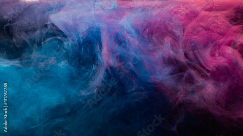 Ink in water. Colorful background. Contrast fume cloud. Soft steam texture. Glowing neon blue magenta pink glitter haze blend on dark.
