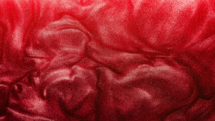 Glitter background. Grain texture. Molten lava abstract design. Sparkling liquid ink swirl. Bright metallic red glowing fluid splash creative wallpaper.
