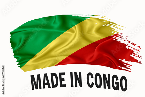 Made in Congo handwritten vintage ribbon flag, brush stroke, typography lettering logo label banner on white background. photo