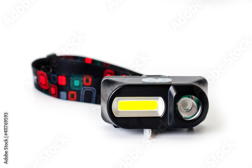 LED headlamp with two light sources for tourism, sports and work.