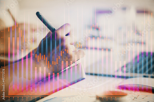 Double exposure of forex graph drawing over people taking notes background. Concept of financial analysis © peshkova