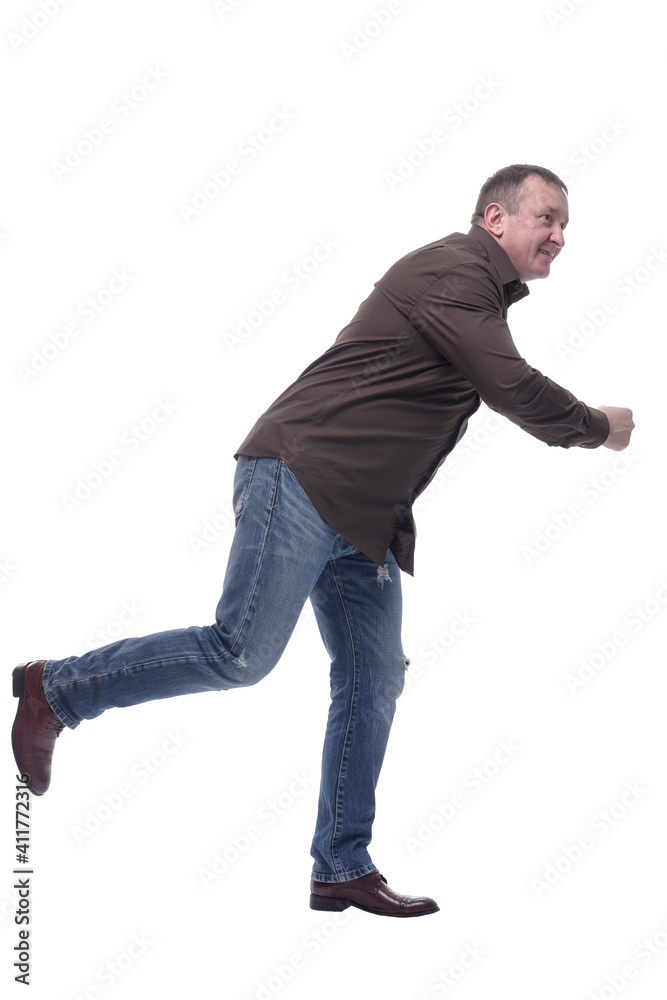 side view . smiling mature man somewhere in a hurry . side view . smiling mature man somewhere in a hurry .