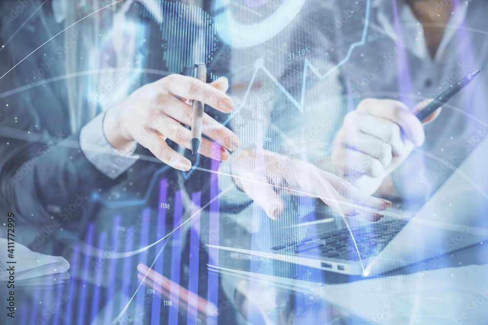 Multi exposure of man and woman working together and financial chart hologram. Business concept. Computer background.