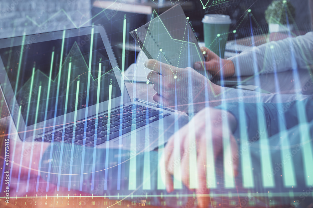 Double exposure of man and woman working together and forex chart hologram. Business concept. Computer background. Double exposure of man and woman working together and forex chart hologram. Business concept. Computer background.