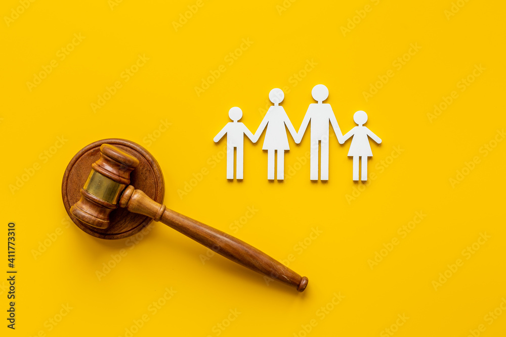 Family figure with judge gavel. Family law concept Family figure with judge gavel. Family law concept